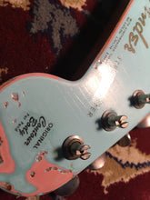 Load image into Gallery viewer, The roasted maple with rosewood and clay dots with shell pink and surf green relic with tusq nut and relic gotoh tuners with fender decals
